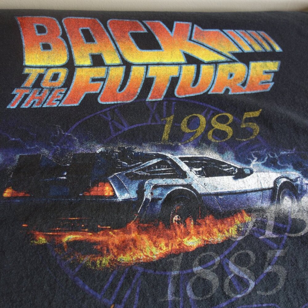 Official BACK TO THE FUTURE 1985 Powered by Flux Capacitor Black T-shirt – 6X